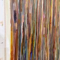 Abstract art with vertical brush strokes in various colors on a textured surface.
