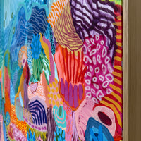 Colorful abstract artwork with vibrant patterns on a textured surface.