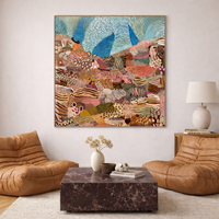 Living room with brown leather chairs, marble coffee table, and JWG abstract artwork on the wall.