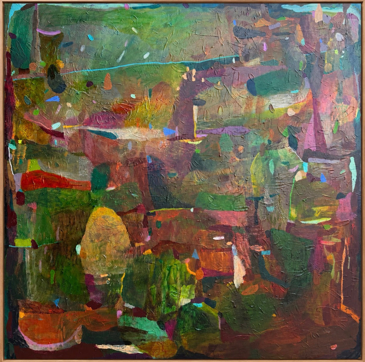 A JWG abstract expressionist painting featuring a textured, impasto style with a rich palette of green, brown, pink, orange, and purple, enclosed in a thin wooden frame.